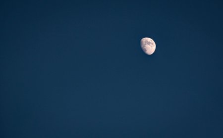 The Moon in a clear sky in the Netherlandsの写真素材