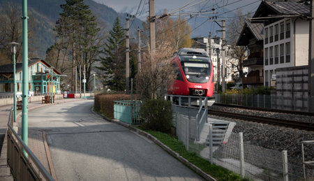 train rails in austrian alpine ski village in the alps in the spring