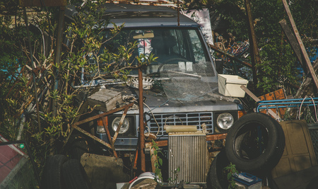 Car wreck old rubbish in green areaのeditorial素材