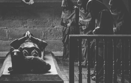monks praying at a french funeral in a castleのeditorial素材
