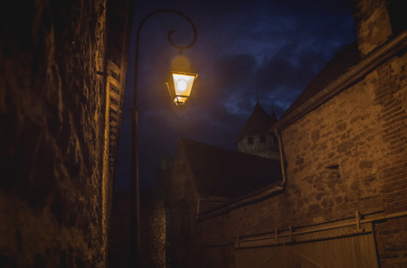 Castle street by night lit by lamps in Rocamadour, franceのeditorial素材