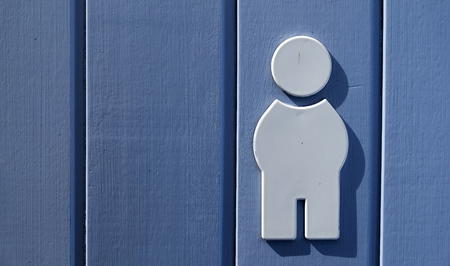 white Men's toilet sign on a blue doorの写真素材