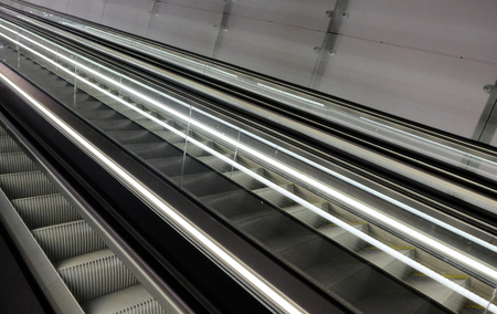 Cutout of multiple escalators in a train stationの写真素材