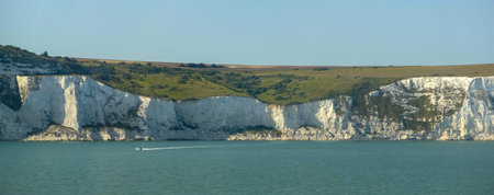 View at white cliffs of Dover, grass, trees and rocks in Southeast Great Britain