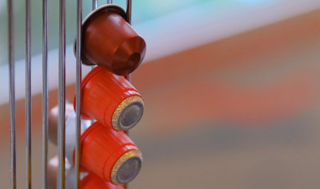 Coffee cups in Holder orange in front of windows in amsterdamの写真素材