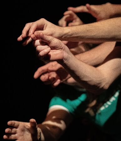 Various arms and hands in the theatre play on stageの写真素材