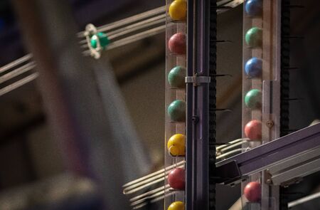 Nice close-up of the colored bowling balls on a lift in nemo amsterdamの写真素材