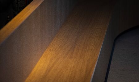 Wooden brown bench in the shape of half a circle. Curved timber bench with full-length backrest in nemo amsterdamの写真素材