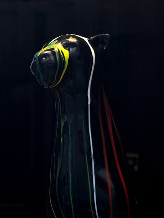 art object of a black dog crying paint on blackの写真素材