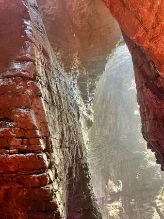 colorfull waterfall in a cave cascate del varone at riva del garda in italyの写真素材