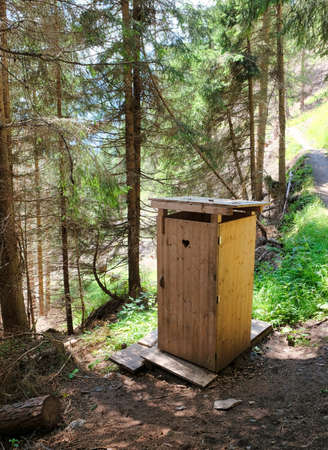 small wooden toilet in the woods of the alps in AUSTRIAの写真素材