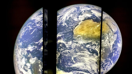 earth on three displays shattered on display at the space expo in netherlandsの写真素材