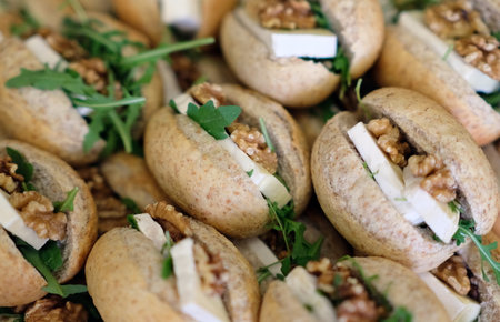 delicious sandwiches on a plate on the table at a partyの写真素材
