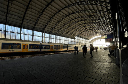 Haarlem station at sunset with people and trains netherlandsの写真素材