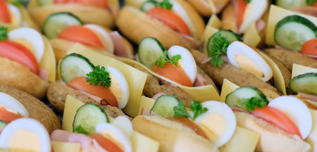 delicious sandwiches on a plate on the table at a partyの写真素材