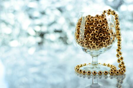 Christmas balls, wine glass, christmas decorations on silver abstract background. Christmas composition.の写真素材