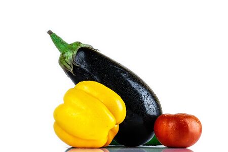 Cucumber, Eggplant, Tomato, Paprika isolated on white blackboard. Organic vegetables. Healthy eating concept.の写真素材