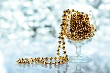 Christmas balls, wine glass, christmas decorations on silver abstract background. Christmas composition.の写真素材