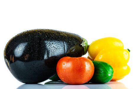 Cucumber, Eggplant, Tomato, Paprika isolated on white blackboard. Organic vegetables. Healthy eating concept.の写真素材
