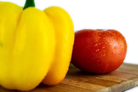 Fresh paprika, cucumber, tomato isolated on wooden blackboard. Organic vegetables. Healthy eating concept.の写真素材
