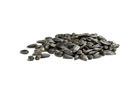 Sunflower seeds, background or texture isolated on white. lose-up. Top viewの写真素材