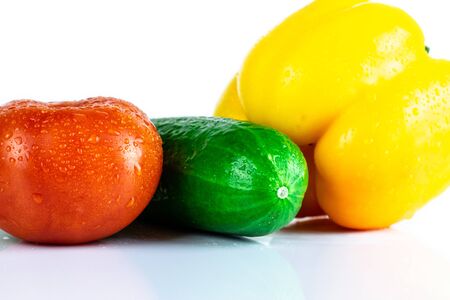 Fresh paprika, cucumber, tomato isolated on white background. Organic vegetables. Healthy eating concept.の写真素材