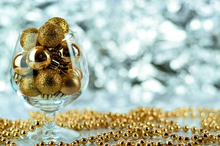Christmas balls, wine glass, christmas decorations on silver abstract background. Christmas composition.の写真素材