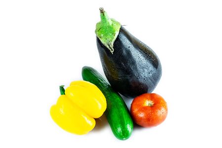 Cucumber, Eggplant, Tomato, Paprika isolated on white blackboard. Organic vegetables. Healthy eating concept.の写真素材