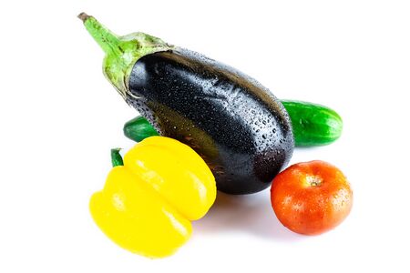 Cucumber, Eggplant, Tomato, Paprika isolated on white blackboard. Organic vegetables. Healthy eating concept. With  .の写真素材