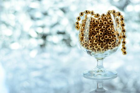 Christmas balls, wine glass, christmas decorations on silver abstract background. Christmas composition.の写真素材