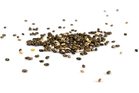 Organic Chia Seed, super food over white background. Healthy breakfast, vitamin snack, diet and healthy eating concept.の写真素材