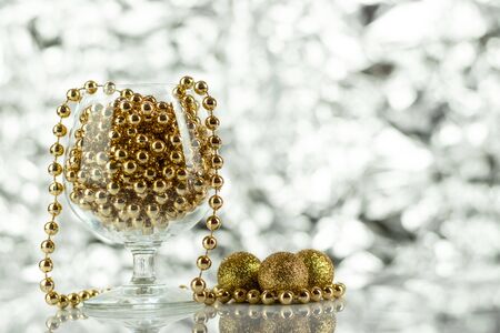 Christmas balls, wine glass, christmas decorations on silver abstract background. Christmas composition.の写真素材