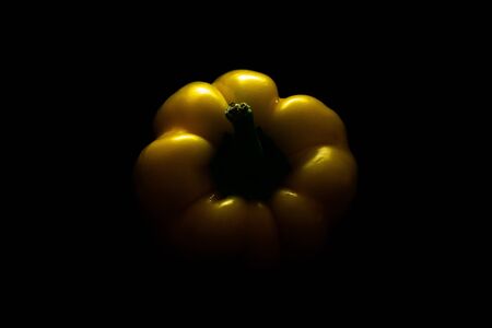Fresh yellow capsicum paprika isolated on black. Healthy eating concept. Bell pepper isolated on black. With clipping path.の写真素材