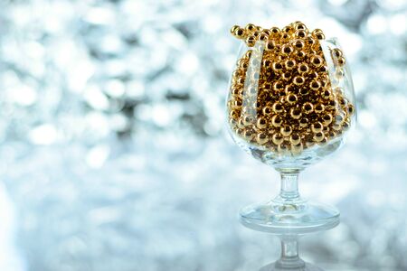 Christmas balls, wine glass, christmas decorations on silver abstract background. Christmas composition.の写真素材