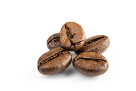 Roasted coffee beans isolated in white background cutout. Coffee background or texture concept.の写真素材