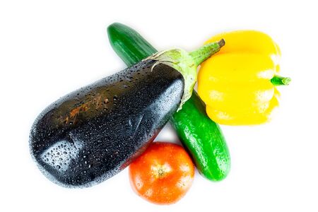 Cucumber, Eggplant, Tomato, Paprika isolated on white blackboard. Organic vegetables. Healthy eating concept.の写真素材