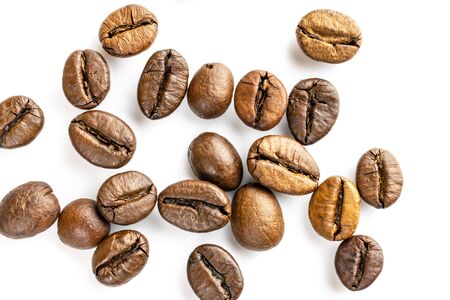 Roasted coffee beans isolated in white background cutout. Coffee background or texture concept.の写真素材