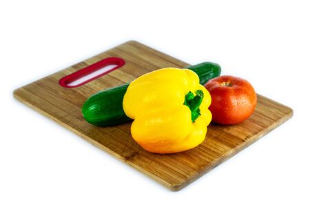 Fresh paprika, cucumber, tomato isolated on wooden blackboard. Organic vegetables. Healthy eating concept.の写真素材