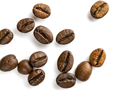 Roasted coffee beans isolated in white background cutout. Coffee background or texture concept.の写真素材