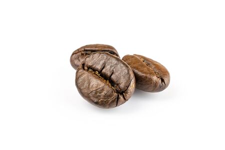 Three shiny fresh roasted coffee beans isolated on white background. Coffee background or texture concept.の写真素材