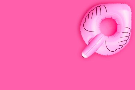 Summer concept. Inflatable pink flamingo isolated on pink background.の写真素材