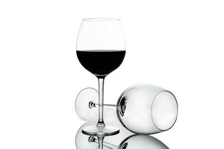 Empty Crystal wine glasses with wine isolated on white background. Alcohol beverage card backdrop.の写真素材