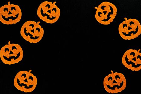 Halloween party. Scary orange pumpkin decoration isolated on blaの写真素材
