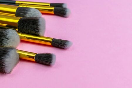 Makeup brush drawing. Cosmetic powder products isolated on pinkの写真素材