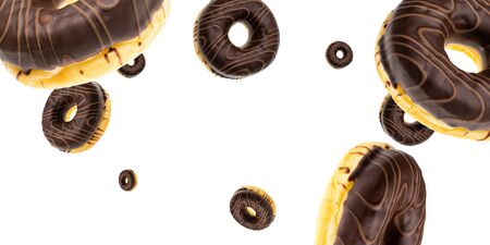 Flying food. Glazed sweet doughnut falling on white background. Treat from delicious pastry breakfast.の写真素材