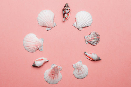 Summer sale. White seashells, red starfish in shape frame isolated on trendy Living Coral pastel...