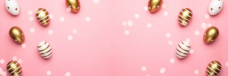 Easter egg hunt. Easter composition: golden shine decorated eggs in basket. Greeting card trendy design. for you poster or flyerの写真素材