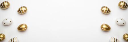 Easter basket with Colorful shine decorated eggs isolated on white background. for you poster or flyerの写真素材