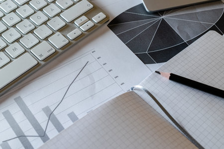 Paperwork on desk. Financial data documents charts graphs diagrams on analytics workspace....