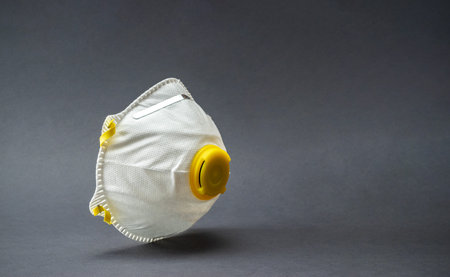 Medical safety filter mask on black background. Coronavirus cell Covid-19 outbreak virus protection ...